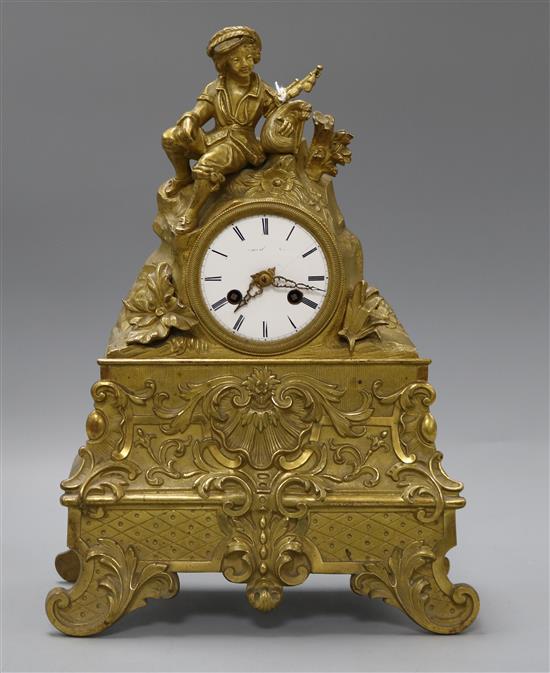 An ormolu figural mantel clock with silk suspension Height 34cm